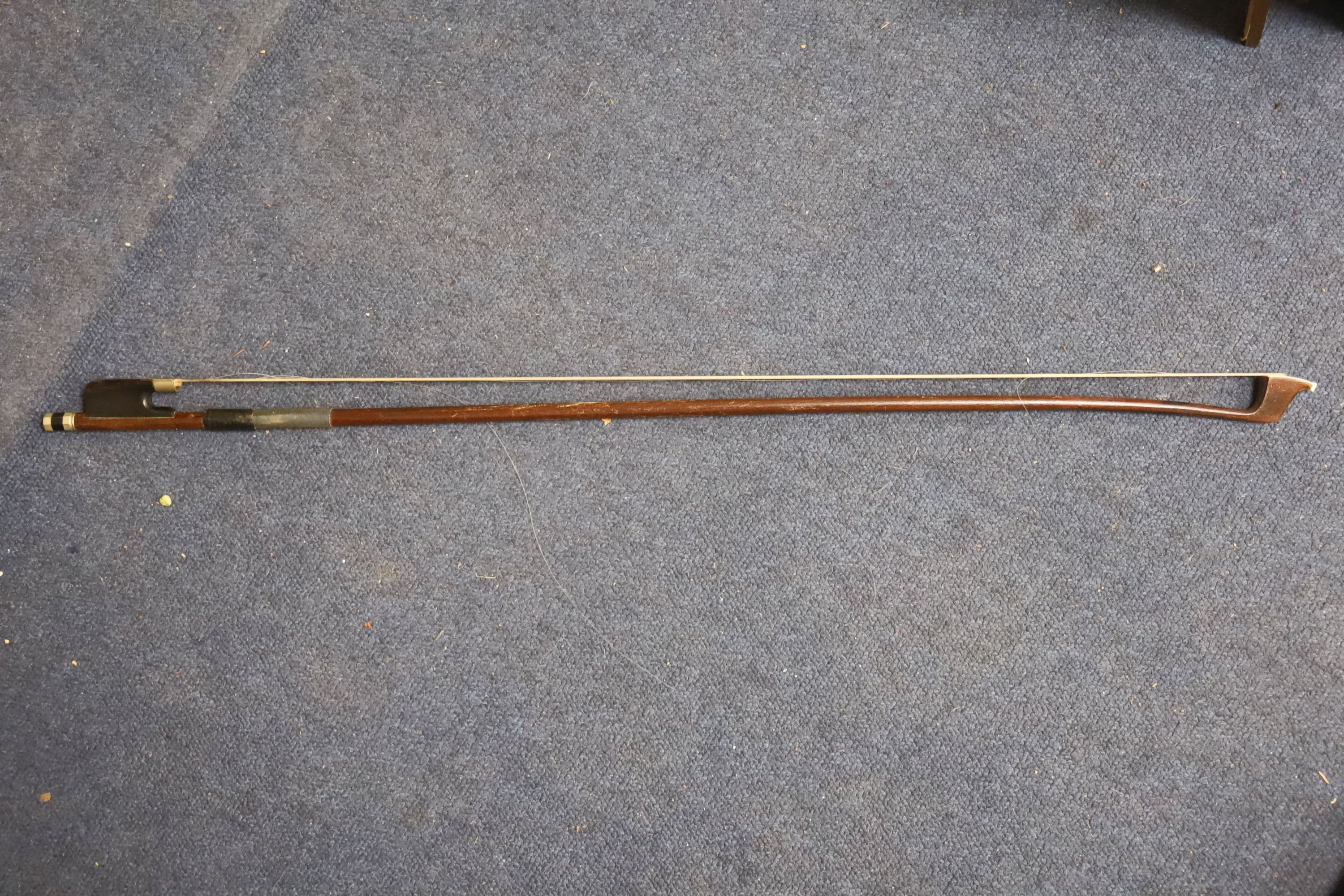 Early 20th century German cello and bow, the back measuring 75cm excluding the button